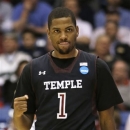 Temple guard Khalif Wyatt clinches his fist as he walks up court during the second half of a second-round game against the North Carolina State at the NCAA college basketball tournament, Friday, March 22, 2013, in Dayton, Ohio. (AP Photo/Al Behrman)