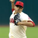Cleveland Indians starting pitcher Jeanmar Gomez throws in the first inning of a baseball game against the Texas Rangers, Saturday, Sept. 1, 2012, in Cleveland. (AP Photo/Tony Dejak)
