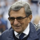 FILE - In this Sept. 12, 2009 file photo, Penn State coach Joe Paterno walks the field before their college football game against Syracuse in State College, Pa. The Hall of Fame coach died of lung cancer on Jan. 22, 2012, at age 85. On Tuesday, Jan. 22, 2013, exactly a year after his passing _ community residents have organized a vigil at a downtown mural that includes a depiction of Paterno. (AP Photo/Carolyn Kaster, File)