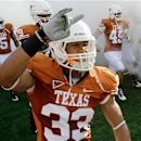 FILE - In this Sept. 11, 2010, file photo, Texas' Jordan Hicks (33) takes the field with teammates to face Wyoming in an NCAA college football game in Austin, Texas. Texas has sent home Hicks and backup quarterback Case McCoy on the eve of the Alamo Bowl in San Antonio for violating team rules, a person with knowledge of the suspensions told The Associated Press. The person spoke to the AP on condition of anonymity Friday, Dec. 28, 2012, because the school wasn't releasing the names of the suspended players. (AP Photo/Eric Gay, File)