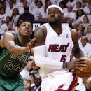 Miami Heat's LeBron James (6) drives to the basket against Boston Celtics' Paul Pierce (34) during the first half of Game 1 in their NBA basketball Eastern Conference finals playoffs series, Monday, May, 28, 2012, in Miami. (AP Photo/Lynne Sladky)