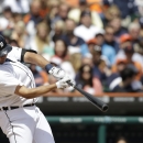Detroit Tigers' Jhonny Peralta connects on a grand slam during the sixth inning of a baseball game against the Philadelphia Phillies in Detroit, Sunday, July 28, 2013. (AP Photo/Carlos Osorio)