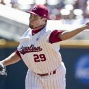 South Carolina starting pitcher Michael Roth delivers against Kent State in the first inning of an NCAA College World Series elimination baseball game in Omaha, Neb., Thursday, June 21, 2012. (AP Photo/Nati Harnik)