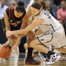 Connecticut's Kelly Faris, right, pressures Louisville's Bria Smith, left, during the first half of an NCAA college basketball game in Hartford, Conn., Tuesday, Jan. 15, 2013. (AP Photo/Jessica Hill)