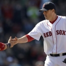 Boston Red Sox starting pitcher John Lackey, right, is congratulated by catcher Jarrod Saltalamacchia after the last out in the sixth inning of a baseball game against the Houston Astros at Fenway Park in Boston, Sunday, April 28, 2013. (AP Photo/Mary Schwalm)