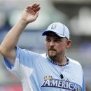 American League designated hitter Billy Butler, of the Kansas City Royals, waves to fans during practice for the MLB All-Star baseball game, Tuesday, July 10, 2012, in Kansas City, Mo. (AP Photo/Jeff Roberson)