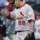 St. Louis Cardinals relief pitcher Fernando Salas adjusts his cap after Chicago Cubs' Darwin Barney hit a two-run home run during the ninth inning of a baseball game in Chicago, Friday, Sept. 21, 2012. The Cubs won 5-4 in 11 innings. (AP Photo/Nam Y. Huh)
