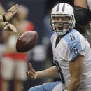 Tennessee Titans quarterback Matt Hasselbeck (8) tosses the ball to an official after he was sacked in the second quarter of an NFL football game against the Houston Texans Sunday, Sept. 30, 2012, in Houston. (AP Photo/Patric Schneider)