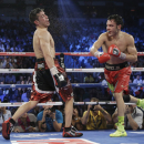 Julio Cesar Chavez Jr., right, lands a punch against Sergio Martinez during the WBC middleweight title fight, Saturday, Sept. 15, 2012, in Las Vegas. Martinez won by unanimous decision. (AP Photo/Julie Jacobson)