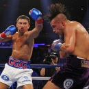 Gennady Golovkin, left, hits David Lemieux in the second round of a middleweight title fight at Madison Square Garden in New York on Saturday, Oct. 17, 2015. Golovkin won in the eighth round. (AP Photo/Rich Schultz)