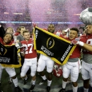 Players from the Alabama Crimson Tide celebreate after beating the Washington Huskies 24 to 7 during the 2016 Chick-fil-A Peach Bowl at the Georgia Dome on December 31, 2016 in Atlanta, Georgia (AFP Photo/STREETER LECKA)
