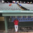 Los Angeles Angels relief pitcher Ernesto Frieri sits in an empty dugout because of a rain delayed start of the baseball game against the Texas Rangers Saturday, Sept. 29, 2012, in Arlington, Texas. (AP Photo/LM Otero)