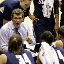 Connecticut head coach Geno Auriemma talks to his team during a timeout in the first half of an NCAA college basketball game against Georgetown, Wednesday, Jan. 9, 2013, in Washington. (AP Photo/Alex Brandon)