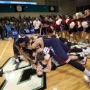 Liberty players celebrate at mid-court after defeating Charleston Southern 87-76 in an NCAA college basketball game in the championship at the Big South Conference tournament on Sunday March 10, 2013 in Conway, S.C. (AP Photo/Willis Glassgow