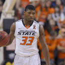 Oklahoma State guard Marcus Smart holds the ball during an NCAA basketball game in Stillwater, Okla., Saturday, Mar. 2, 2013. Oklahoma State defeated Texas 78-65. (AP Photo/Brody Schmidt)