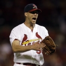 St. Louis Cardinals starting pitcher Adam Wainwright celebrates after getting Texas Rangers' Adrian Beltre to fly out to end the top of the sixth inning inning of a baseball game on Sunday, June 23, 2013, in St. Louis. (AP Photo/Jeff Roberson)