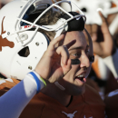 Texas' Case McCoy sings the school song after the team's 35-13 win over Kansas in an NCAA college football game, Saturday, Nov. 2, 2013, in Austin, Texas. (AP Photo/Eric Gay)