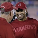 Stanford head coach David Shaw, right, shakes hands with honorary captain Jack Lasater after defeating UCLA 35-17 during their NCAA college football game, Saturday, Nov. 24, 2012, in Pasadena, Calif. (AP Photo/Alex Gallardo)