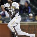 Pittsburgh Pirates' Starling Marte hits a two-RBI triple against the Chicago Cubs during the third inning of a baseball game, Monday, Sept. 17, 2012, in Chicago. (AP Photo/Jim Prisching)