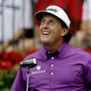Phil Mickelson smiles as he prepares to tee off on the first hole during the first round of the Tour Championship golf tournament Thursday, Sept. 20, 2012, in Atlanta. (AP Photo/David Goldman)