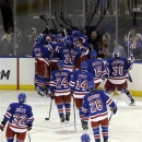 The New York Rangers celebrate a goal by Chris Kreider after the overtime period in Game 4 of the Eastern Conference semifinals in the NHL hockey Stanley Cup playoffs against the Boston Bruins, Thursday, May 23, 2013, in New York. The Rangers won the game 4-3. (AP Photo/Frank Franklin II)