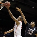 North Carolina State guard Lorenzo Brown (2) drives past Temple forward Rahlir Hollis-Jefferson (32) in the second half of a second-round game at the NCAA college basketball tournament, Friday, March 22, 2013, in Dayton, Ohio. (AP Photo/Al Behrman)
