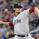 FILE - In this May 17, 2013, file photo, Boston Red Sox pitcher Clay Buchholz throws against the Minnesota Twins in the first inning of a baseball game in Minneapolis. Buchholz is ready to rejoin the Boston Red Sox rotation after missing three months with a strained neck. (AP Photo/Jim Mone, File)