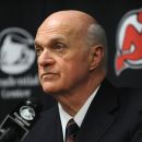 FILE - In this Jan. 8, 2010, file photo, New Jersey Devils general manager Lou Lamoriello talks to the media after their NHL hockey game with the Tampa Bay Lightning in Newark, N.J, had to be postponed due to lighting issues Lamoriello was named Wednesday, July 11, 2012, to this year's induction class of the U.S. Hockey Hall of Fame. (AP Photo/Bill Kostroun, File)