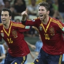 Spain's Sergio Busquets, left, and Sergio Ramos celebrate after defeating Italy 7-6 during a penalty shoot-out in the soccer Confederations Cup semifinal match at the Castelao stadium in Fortaleza, Brazil, Thursday, June 27, 2013. (AP Photo/Eugene Hoshiko)
