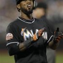 Miami Marlins shortstop Jose Reyes reacts after beating out an infield grounder for a fourth-inning single in the Marlins' 4-2 victory over the New York Mets in a baseball game in New York, Tuesday, Aug. 7, 2012. Reyes extended his hitting streak to 25 games. (AP Photo/Kathy Willens)