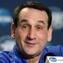 Duke head coach Mike Krzyzewski smiles as he talks to reporters during a news conference, Saturday, March 30, 2013, in Indianapolis. Duke is scheduled to play Louisville in the Midwest Regional final in the NCAA college basketball tournament on Sunday. (AP Photo/Kiichiro Sato)