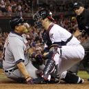 Detroit Tigers' Miguel Cabrera, left, is tagged out at home plate by Minnesota Twins catcher Joe Mauer, center, as home plate umpire Ron Kulpa, right, looks on, during the sixth inning of a baseball game, Friday, Sept. 28, 2012, in Minneapolis. (AP Photo/Genevieve Ross)