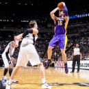 SAN ANTONIO, TX - APRIL 11: Pau Gasol #16 of the Los Angeles Lakers shoots against Tiago Splitter #22 of the San Antonio Spurs at the AT&T Center on April 11, 2012 in San Antonio, Texas