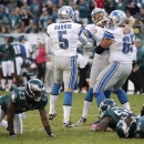 Detroit Lions kicker Jason Hanson, center, is congratulated by Dylan Gandy (65) and Nick Harris (5) after kicking a 45-yard field goal to give the Lions a 26-23 overtime victory over the Philadelphia Eagles during an NFL football game, Sunday, Oct. 14, 2012, in Philadelphia, Philadelphia. (AP Photo/Mel Evans)