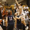 Pennsylvania's Zack Rosen (1) fails to stop Princeton's Jimmy Sherburne (3) from scoring during the first half of an NCAA college basketball game in Princeton, N.J. on Tuesday, March 6, 2012. (AP Photo/Tim Larsen)