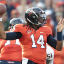 Virginia quarterback Phillip Sims (14) throws a pass during the second half of an NCAA college football game against Miami in Charlottesville, Va., Saturday, Nov. 10, 2012. Virginia won 41-40. (AP Photo/Steve Helber)