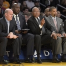 FILE - In this Nov. 9, 2012 file photo, Los Angeles Lakers interim head coach Bernie Bickerstaff, second from right, looks on along with assistant coaches Steve Clifford, left, Chuck Person, second from left, and Eddie Jordan, right, during the first half of their NBA basketball game against the Golden State Warriors in Los Angeles. Michael Jordan felt he needed a head coach with a little more NBA experience this time around to improve his struggling Charlotte Bobcats. The former NBA superstar and current owner believes he's found one in Steve Clifford. (AP Photo/Mark J. Terrill, File)