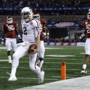 Texas A&M's Johnny Manziel (2) reaches the end zone for a touchdown as Oklahoma's Frank Shannon (20) and others give chase in the first half of the Cotton Bowl NCAA college football game Friday, Jan. 4, 2013, in Arlington, Texas. (AP Photo/LM Otero)