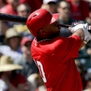 In this photo taken March 23, 2013, Los Angeles Angels' Vernon Wells bats against the Milwaukee Brewers during the third inning of a spring training baseball game in Tempe, Ariz. Wells might become the latest addition to the New York Yankees' injury-depleted lineup. (AP Photo/Chris Carlson)
