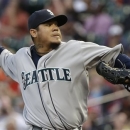 Seattle Mariners' Felix Hernandez delivers a pitch against the Houston Astros in the first inning of a baseball game Monday, April 22, 2013, in Houston. (AP Photo/Pat Sullivan)