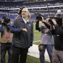 Indianapolis Colts head coach Chuck Pagano acknowledges the fans after walking onto the field before an NFL football game against the Houston Texans, Sunday, Dec. 30, 2012, in Indianapolis. Pagano is back as coach after nearly three months of treatments for leukemia. (AP Photo/Michael Conroy)
