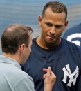 New York Yankees third baseman Alex Rodriguez, right, talks to Yankees general manager Brian Cashman before the Yankees play the Texas Rangers in a baseball game at Yankee Stadium in New York, Tuesday, July 1, 2008. (AP Photo/Kathy Willens)