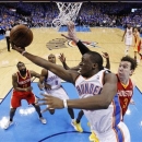 Oklahoma City Thunder guard Reggie Jackson (15) shoots in front of Houston Rockets center Omer Asik (3) in the fourth quarter of Game 5 of their first-round NBA basketball playoff series in Oklahoma City, Wednesday, May 1, 2013. Houston won 107-100. (AP Photo/Sue Ogrocki)