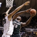 Michigan State center Derrick Nix, right, shoots over Purdue center A.J. Hammons in the first half of an NCAA college basketball game in West Lafayette, Ind., Saturday, Feb. 9, 2013. (AP Photo/Michael Conroy)