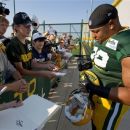Green Bay Packers defensive end Jerel Worthy (99) signs an autograph before NFL football training camp, Tuesday, July 31, 2012, in Green Bay, Wis. (AP Photo/Mike Roemer)