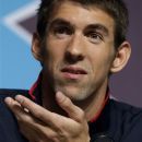U.S. swimmer Michael Phelps speaks at a press conference held at the media center of the 2012 Summer Olympics, Thursday, July 26, 2012, in London. Phelps insists these will be his last games. The 14-time gold medalist will go out with a bang, aiming to claim the unofficial title of greatest Olympian ever from Soviet gymnast Larisa Latynina. (AP Photo/Ng Han Guan)