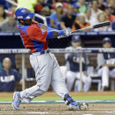 Dominican Republic's Hanley Ramirez follows through on his solo home run against the United States during the second inning of a second-round game of the World Baseball Classic in Miami, Thursday, March 14, 2013. (AP Photo/Wilfredo Lee)