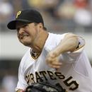 Pittsburgh Pirates starting pitcher Erik Bedard (45) throws against the New York Mets in the second inning of the baseball game on Monday, May 21, 2012, in Pittsburgh. (AP Photo/Keith Srakocic )