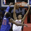 Cleveland Cavaliers' Shaun Livingston, right, cannot score under pressure from Los Angeles Clippers' Ronny Turiaf, from France, during the second quarter of an NBA basketball game on Friday, March 1, 2013, in Cleveland. (AP Photo/Tony Dejak)