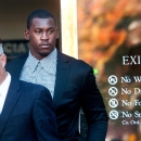 Accompanied by his attorney Joshua Bentley, left, San Francisco 49ers linebacker Aldon Smith leaves an arraignment at Santa Clara County Superior Court on Tuesday, Nov, 12, 2013, in San Jose, Calif. Smith faces three felony counts of illegal possession of an automatic weapon stemming from a party at his home in June 2012. (AP Photo/Noah Berger)